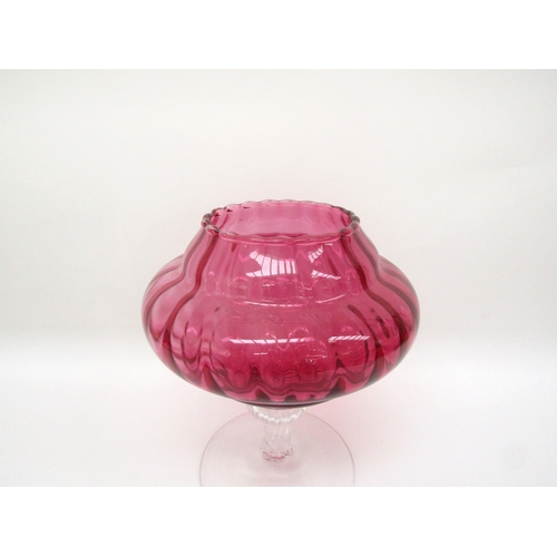 6119 - A cranberry glass lidded jar on pedestal base, one piece of prunt work damaged, 33cm tall