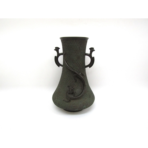 6123 - An Oriental bronze twin-handled vase with applied dragon, signed to base, 31cm tall  )(R)  £180