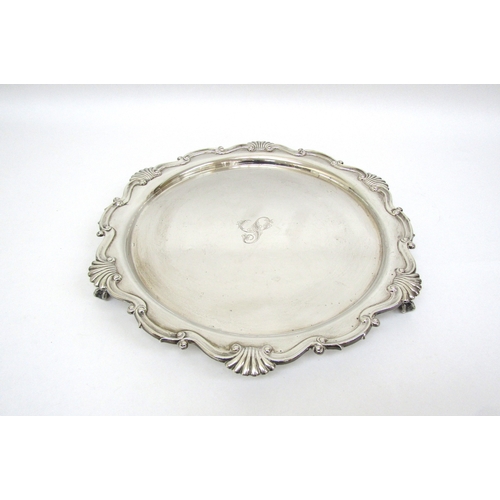 6155 - A Martin Hall and Co silver salver on claw and ball feet, Sheffield 1911, 32cm diameter, 800g