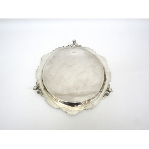 6155 - A Martin Hall and Co silver salver on claw and ball feet, Sheffield 1911, 32cm diameter, 800g