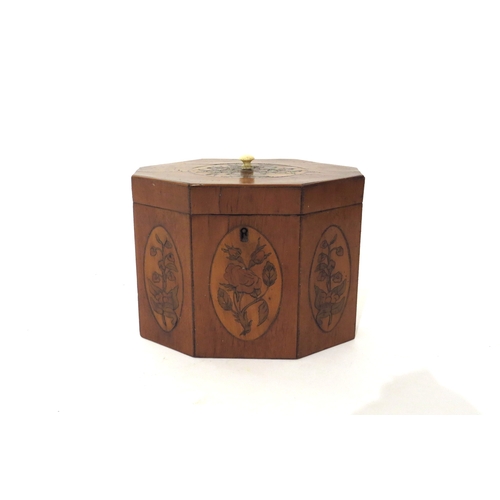 6168 - A 19th Century mixed wood octagonal tea caddy with velvet lined interior.  The top and three front p... 