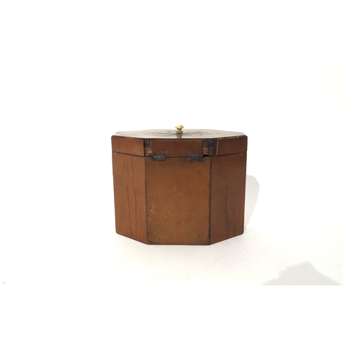 6168 - A 19th Century mixed wood octagonal tea caddy with velvet lined interior.  The top and three front p... 