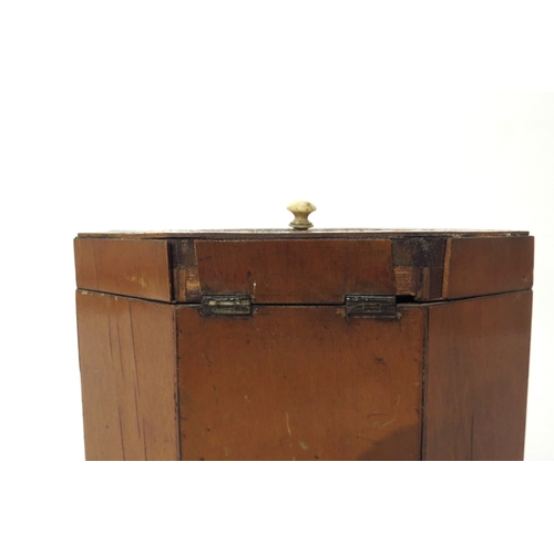 6168 - A 19th Century mixed wood octagonal tea caddy with velvet lined interior.  The top and three front p... 