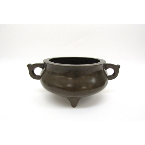 6342 - A Chinese tripod censer, seal mark to base, 8cm tall