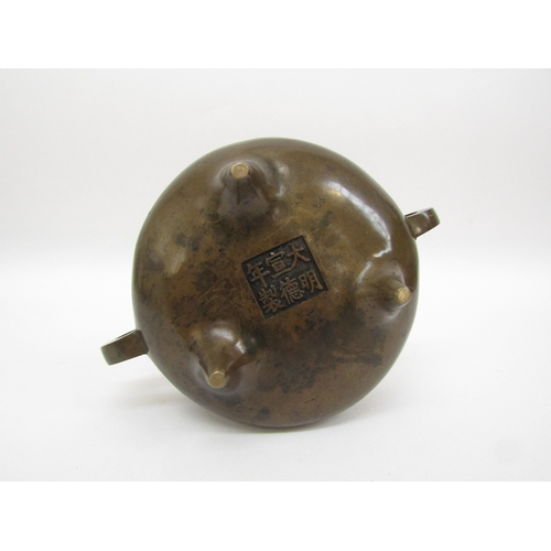 6342 - A Chinese tripod censer, seal mark to base, 8cm tall