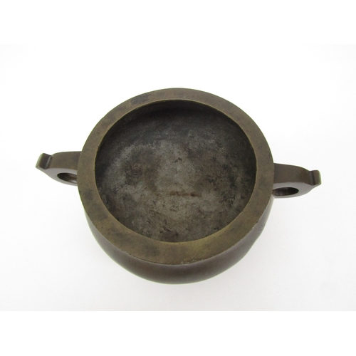 6342 - A Chinese tripod censer, seal mark to base, 8cm tall