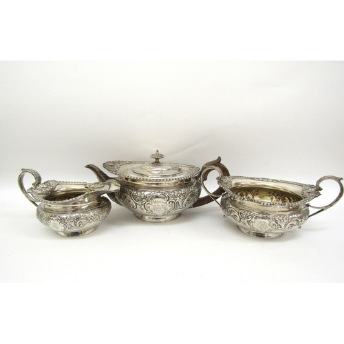 6363 - An Edward Barnard and Sons ornate silver three piece tea set,retailed by Mackay and Chisholm Edinbur... 