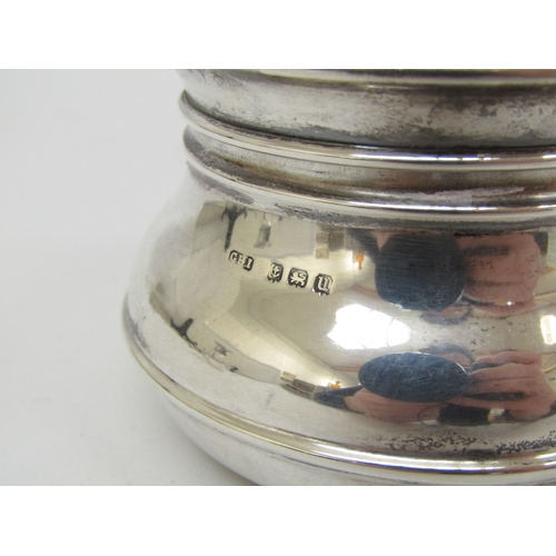 6398 - A tortoise shell lidded silver pot and similar glass bottle (2)