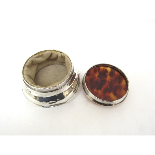 6398 - A tortoise shell lidded silver pot and similar glass bottle (2)