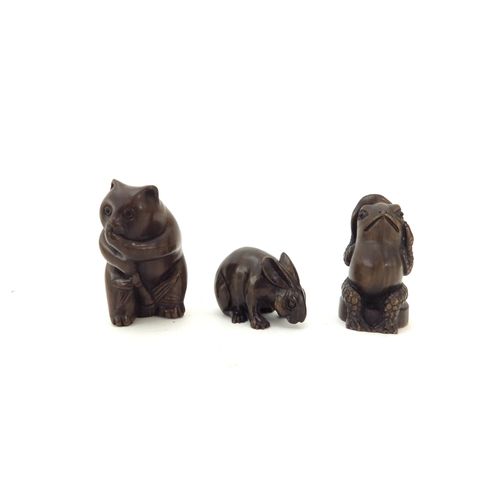 6411 - Three Meiji period (1868-1912) signed Japanese wood Netsukes, Toad, Rabbit and Panda bear 5, 4.5 and... 