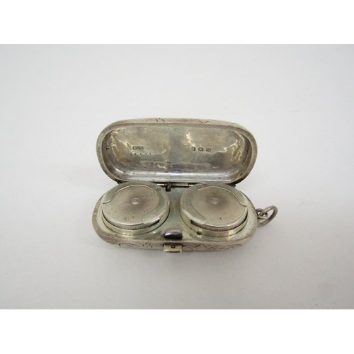 6448 - An Aaron Lufkin Dennison silver double sovereign case with engraved detail, Birmingham 1911, 5.7cm l... 