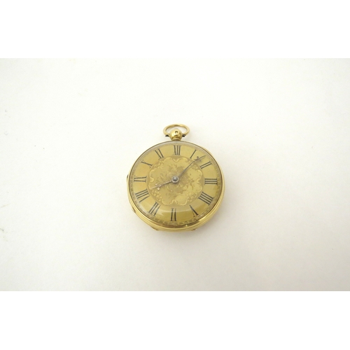 6460 - An 18ct gold engraved pocket watch with key, 33.1g total,  4cm diameter  (C)