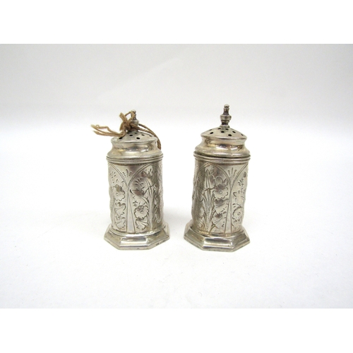 6472 - A silver mustard (no glass liner) pair of Victorian silver pepperettes and two Chester silver salts ... 