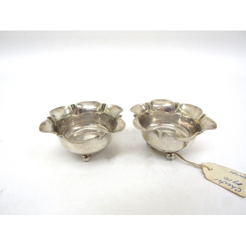 6472 - A silver mustard (no glass liner) pair of Victorian silver pepperettes and two Chester silver salts ... 