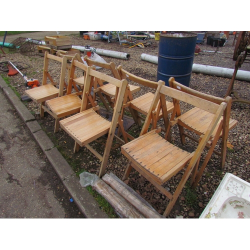 3285 - Eight wooden folding chairs