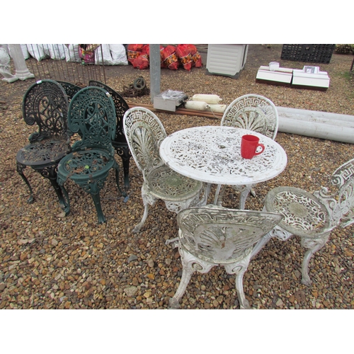 3308 - Four pierced alloy garden chairs, cafe table and four chairs