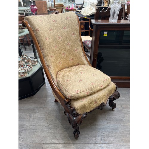 6109 - A circa 1840 mahogany scroll back slipper chair the serpentine front seat over carved scroll cabriol... 