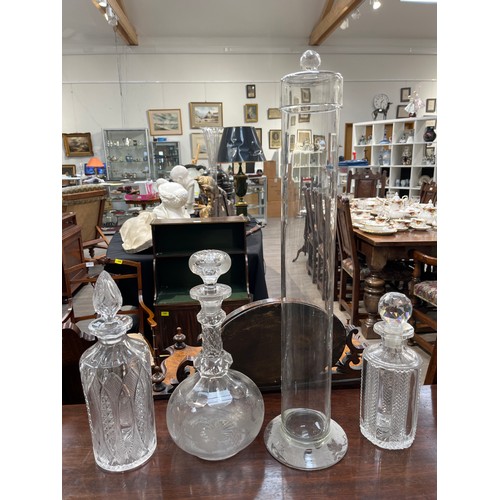 6110 - Three 19th Century decanters and a chemist lidded cylindrial vessel (4) chips present