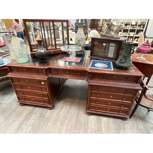 6126 - A reproduction flame walnut partner's desk, the three-section tooled leather top over a three drawer... 