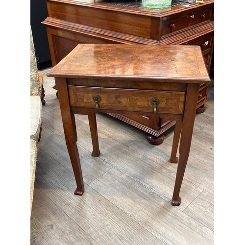 6132 - A herringbone crossbanded burr walnut and fruitwood lowboy, the single frieze drawer over square sec... 