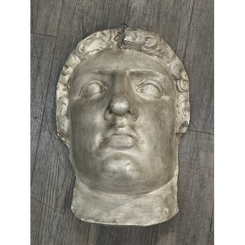 6147 - A plaster wall hanging bust of Colossus, 56cm x 40cm