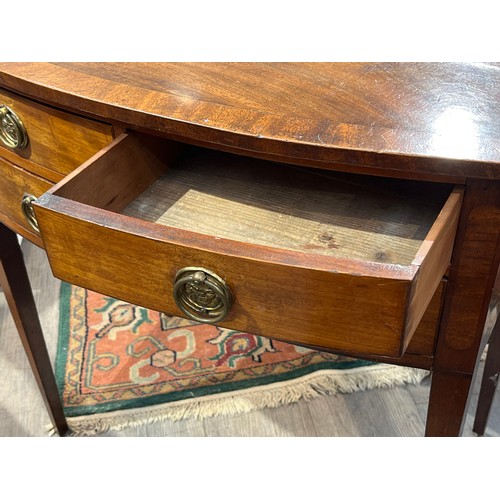 6162 - A late George III mahogany bow-fronted mahogany side table, two drawers over single long drawer, on ... 