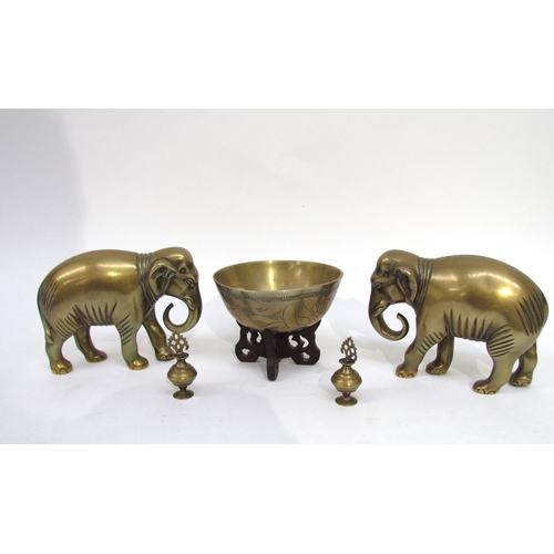 6050 - An Oriental singing bowl, pair of brass elephants and two miniature brass scent bottles (5)