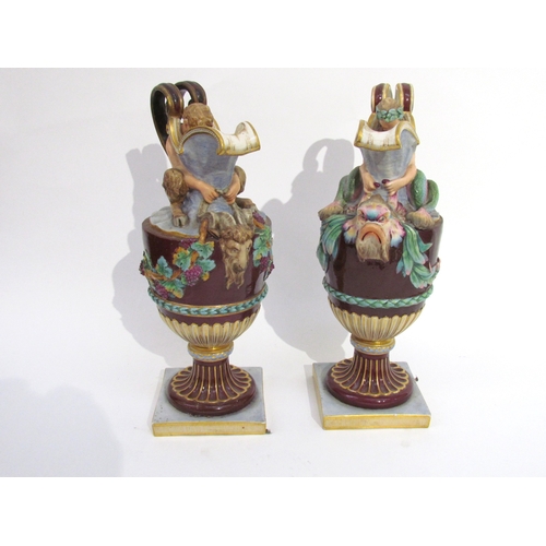 6052 - A pair of late 19th/early 20th Century Naples jugs with Merman and Pan to spout, 40cm tall, approx 2... 