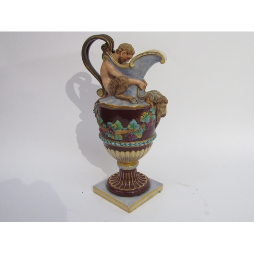 6052 - A pair of late 19th/early 20th Century Naples jugs with Merman and Pan to spout, 40cm tall, approx 2... 