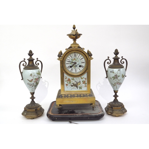 6076 - A Waterhouse & Co brass and enamel French clock garniture with bird detail, back open, 37cm x 18cm