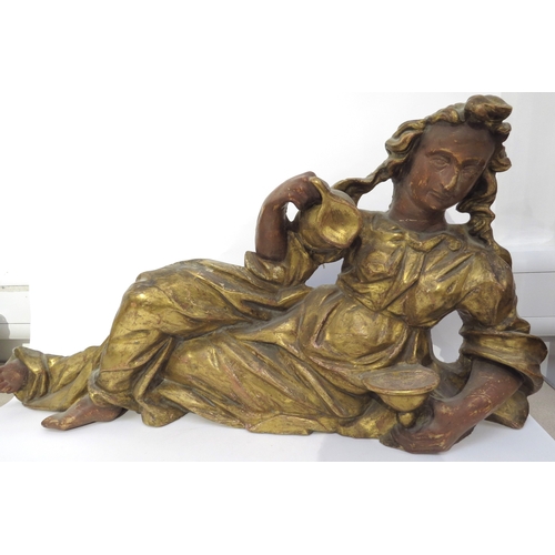 6149 - A 19th Century carved giltwood recumbent female figure holding a jug, 97cm x 46cm