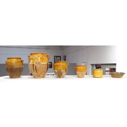 6296 - Four late 19th/early 20th Century French traditional glazed earthenware confit jars, one with hairli... 