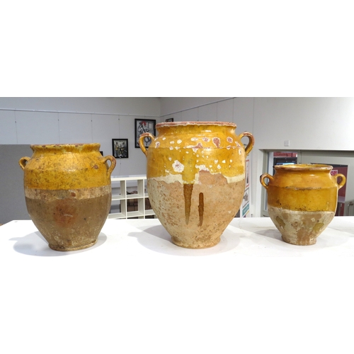 6296 - Four late 19th/early 20th Century French traditional glazed earthenware confit jars, one with hairli... 