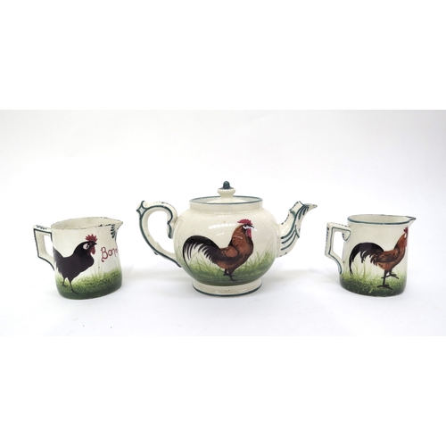 6299 - Wemyss ware teapot and jug both marked T Goode & Co South Audley and similar jug unmarked with cocke... 