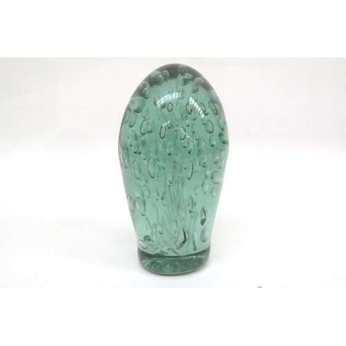 6324 - A Victorian green glass dump with bubble inclusion, 16.5cm tall