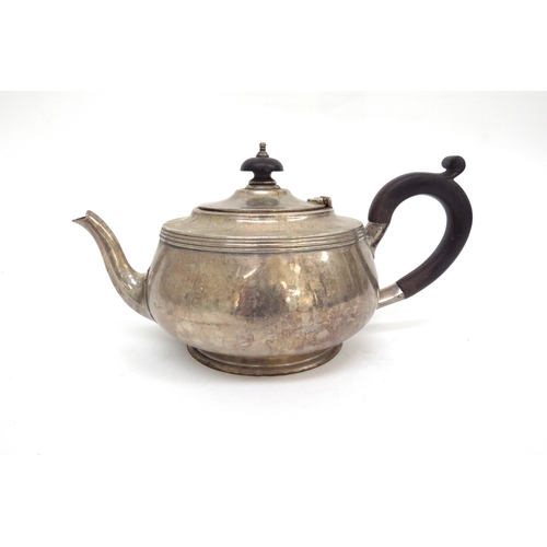 6480 - A Silver teapot with ebony knop and handle, London 1930 makers mark rubbed, 694g