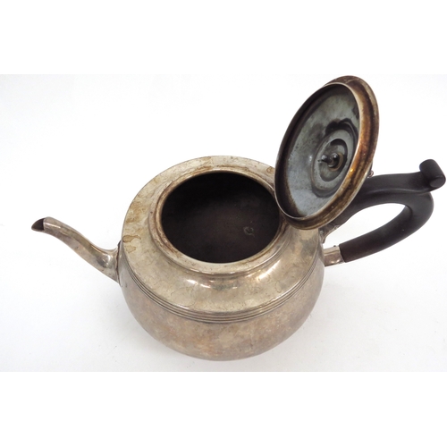 6480 - A Silver teapot with ebony knop and handle, London 1930 makers mark rubbed, 694g