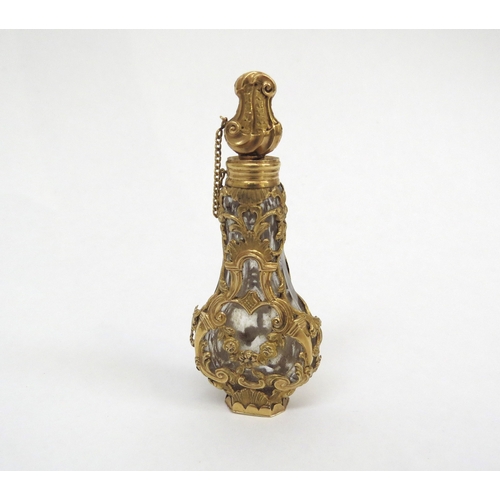 6483 - An 18th Century gold overlay banjo shaped glass scent bottle with stopper in original shagreen case,... 