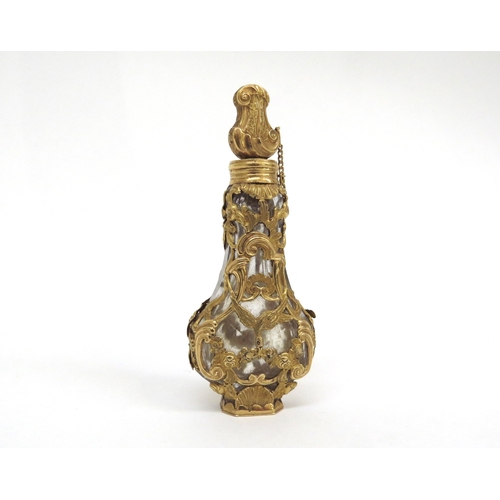 6483 - An 18th Century gold overlay banjo shaped glass scent bottle with stopper in original shagreen case,... 