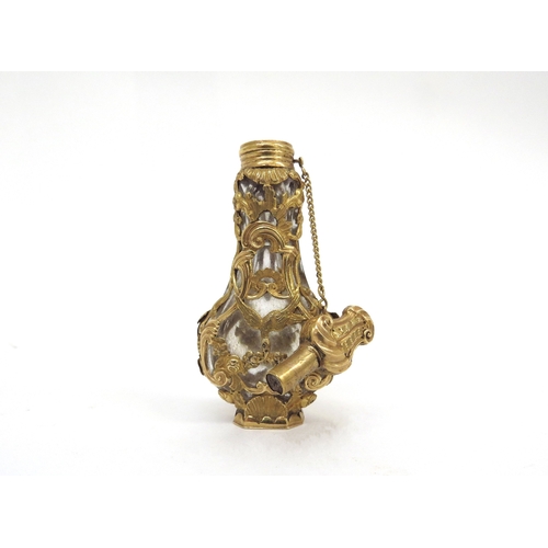 6483 - An 18th Century gold overlay banjo shaped glass scent bottle with stopper in original shagreen case,... 