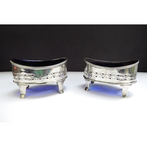 6365 - A pair of John Emes silver salts, pierced and etched decoration, London 1799, one blue glass liner a... 