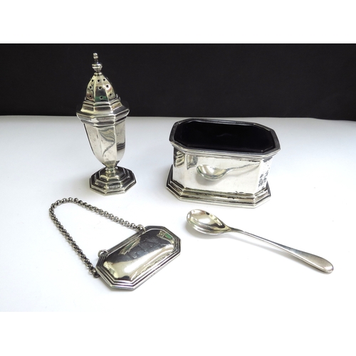 6369 - A silver salt with blue glass liner, salt spoon, Gin decanter label and pepperette, various makers a... 