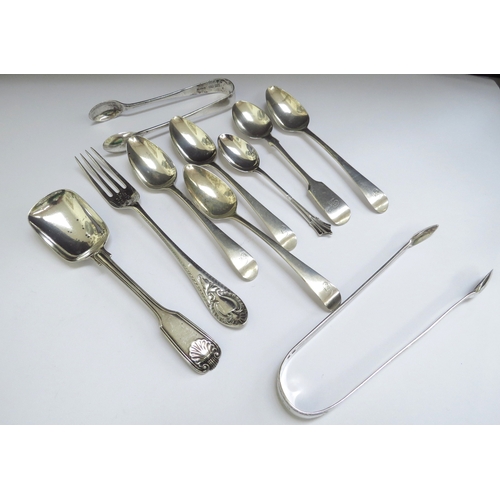 6371 - Two silver sugar nips, various silver teaspoons, caddy spoon and small fork, 190g