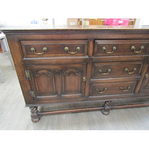 6204 - Muirhead Moffat & Co Glasgow Georgian style oak sideboard with central drawers flanked by cupboards,... 