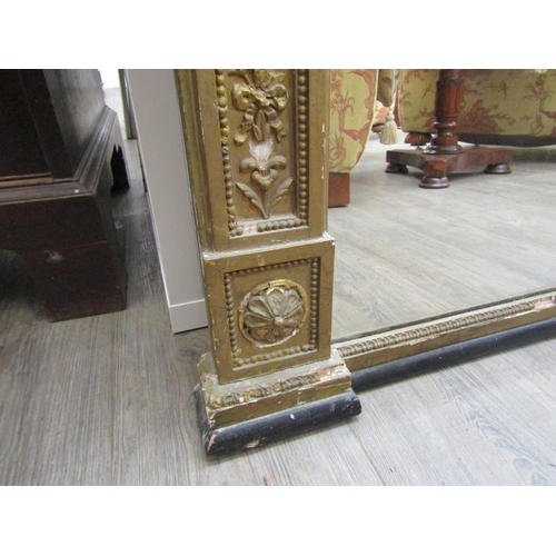 6207 - A 19th century gilt an gesso overmantel mirror with ribbon and swag detail, some gesso elements miss... 