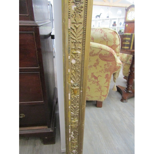 6207 - A 19th century gilt an gesso overmantel mirror with ribbon and swag detail, some gesso elements miss... 