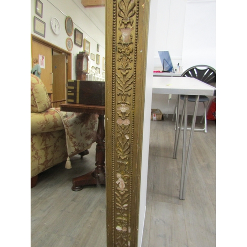 6207 - A 19th century gilt an gesso overmantel mirror with ribbon and swag detail, some gesso elements miss... 