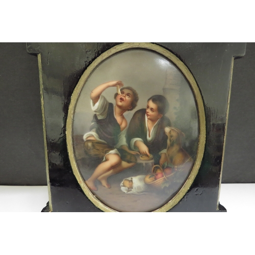 6418 - A 19th Century Continental porcelain oval panel painted with scene of two young boys with dog and ba... 