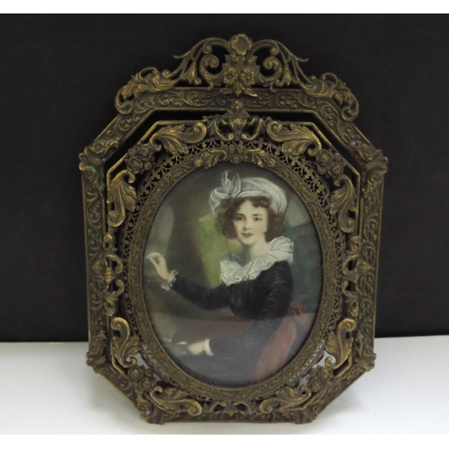 6420 - A Mid 19th Century miniature watercolour on ivory oval panel depicting young female artist with pale... 