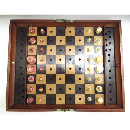 6426 - A Jacques London mahogany cased travelling chess set with stained red bone and natural pieces, gilt ... 